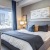 a bedroom with a large window
