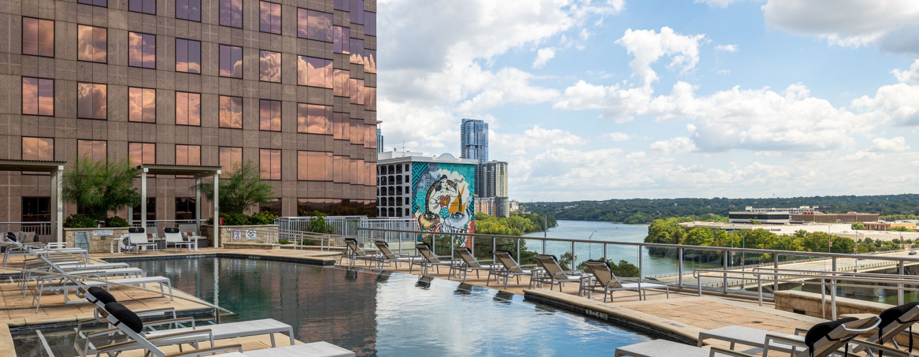 Swimming pool and sundeck overlooking Lady Bird Lake at Ashton Austin luxury apartments in Austin, TX