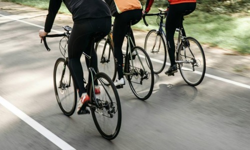 a group of people riding bikes